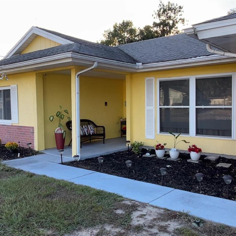 1495 Bishop Road Spring Hill, FL 34608 - Photo 3 of 34 a front view of a house