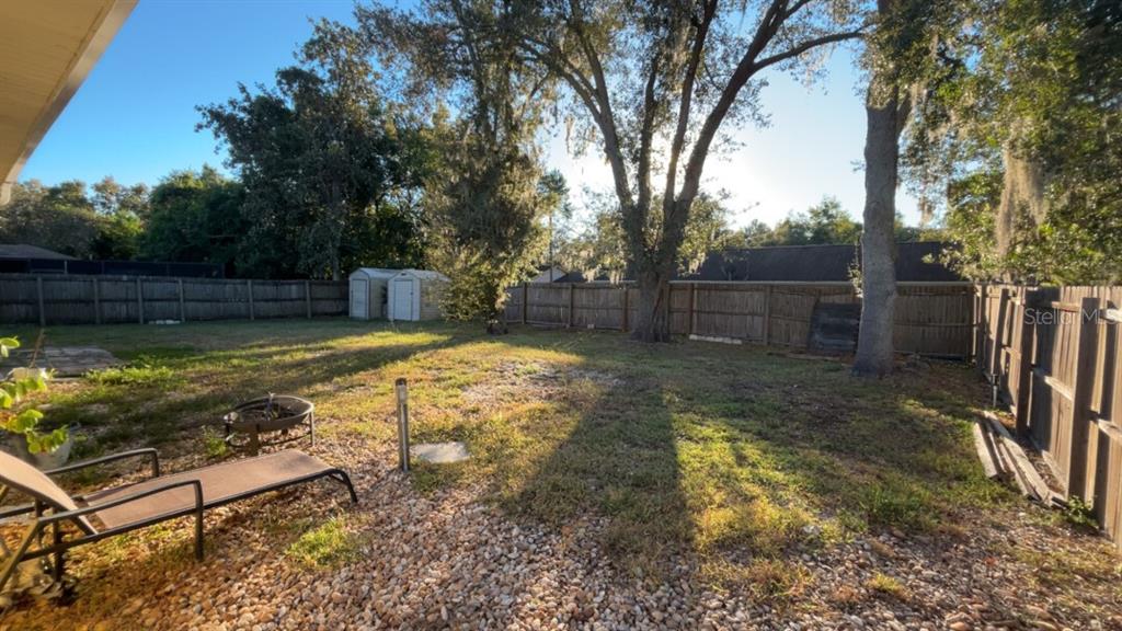 1495 Bishop Road Spring Hill, FL 34608 - Photo 31 of 34 a view of a backyard with swimming pool