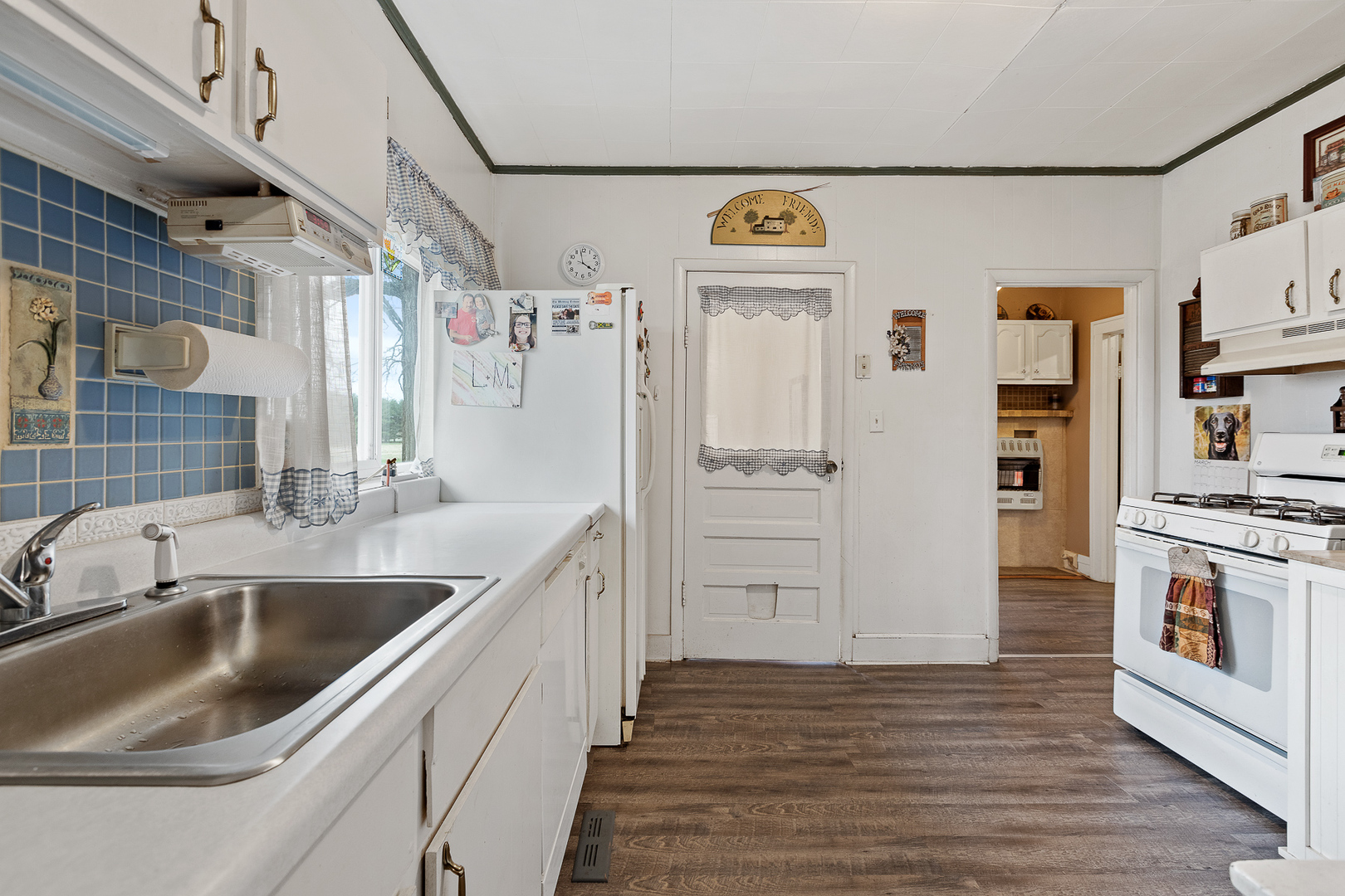 5714 East 3500S Road St. Anne, IL 60964 - Photo 13 of 35 a kitchen with stainless steel appliances granite countertop a refrigerator and a sink