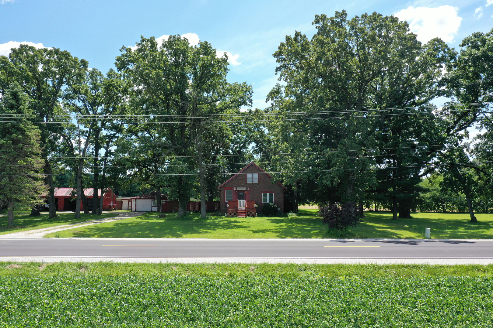 5714 East 3500S Road St. Anne, IL 60964 - Photo 3 of 35 a house that has a tree in front of it