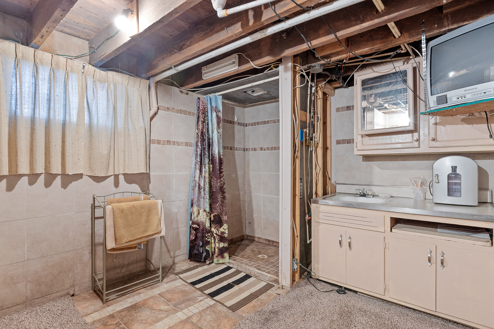 5714 East 3500S Road St. Anne, IL 60964 - Photo 24 of 35 a utility room with closet a mirror and shower