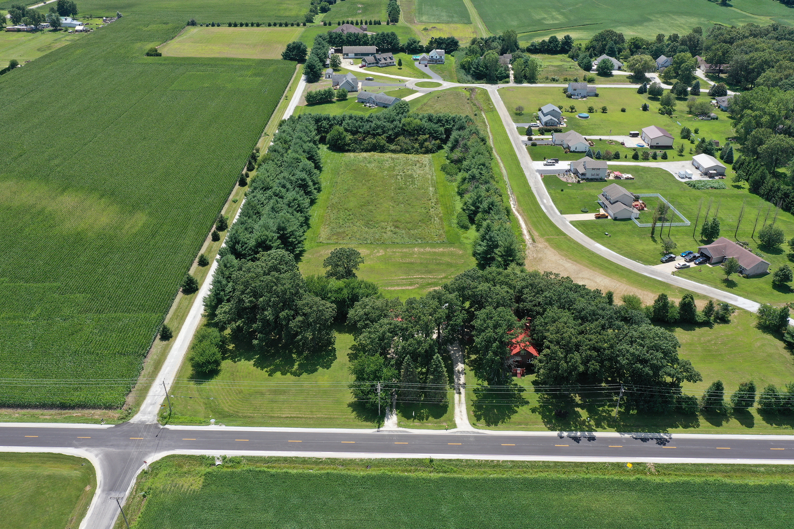 5714 East 3500S Road St. Anne, IL 60964 - Photo 4 of 35 an aerial view of residential houses with outdoor space and trees