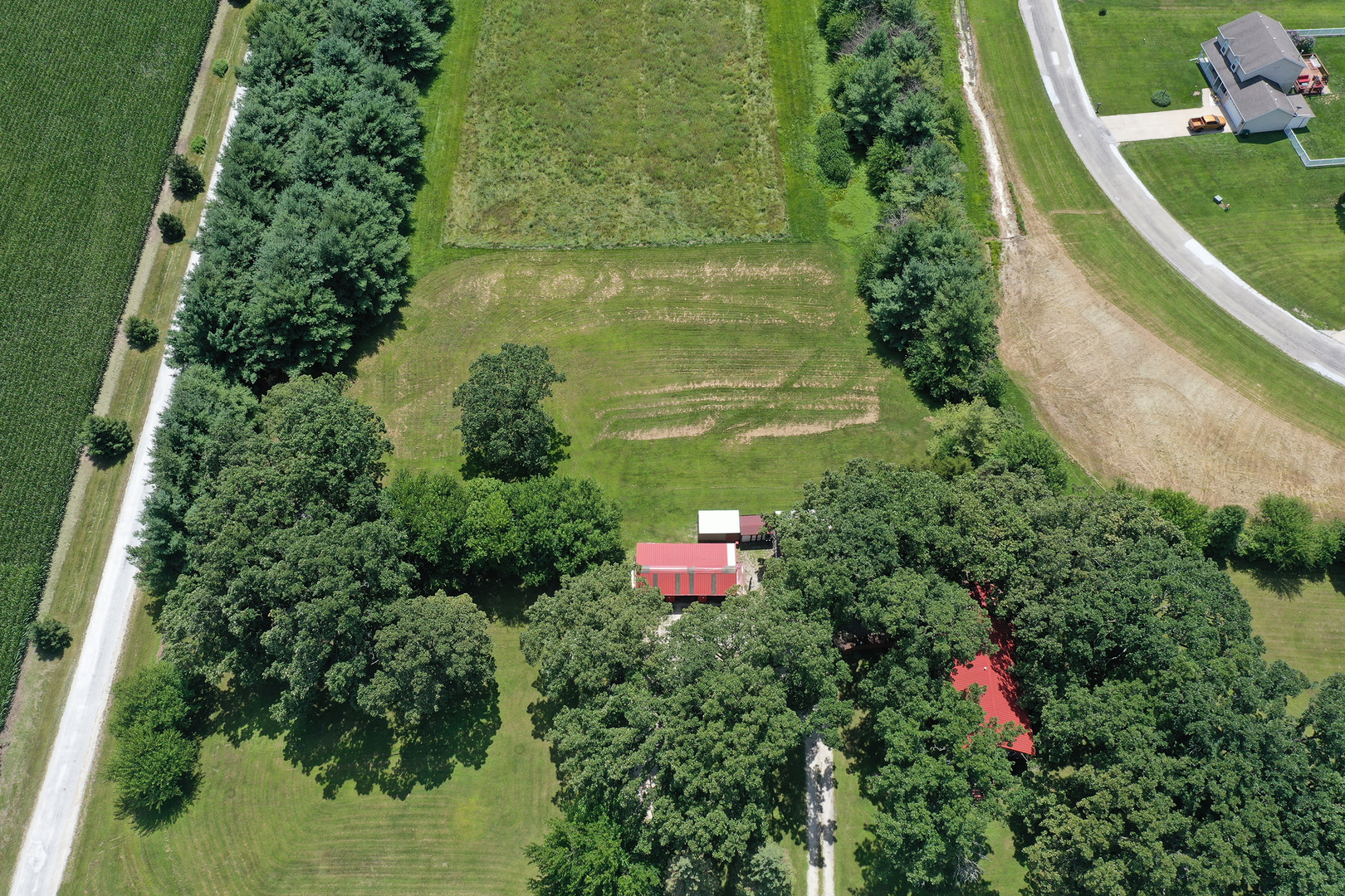 5714 East 3500S Road St. Anne, IL 60964 - Photo 31 of 35 an aerial view of residential house with outdoor space and trees all around