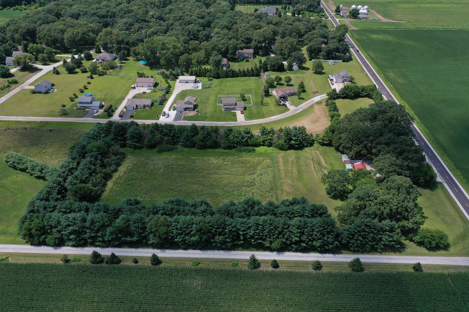 5714 East 3500S Road St. Anne, IL 60964 - Photo 34 of 35 an aerial view of a house with a yard basket ball court and outdoor seating