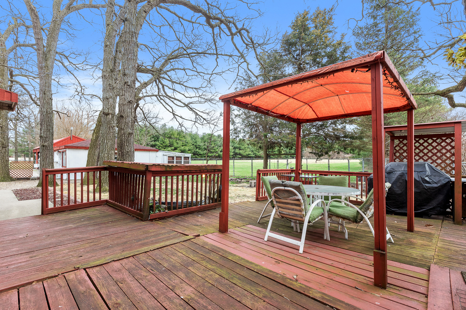 5714 East 3500S Road St. Anne, IL 60964 - Photo 10 of 35 a view of a two chairs and table in the deck