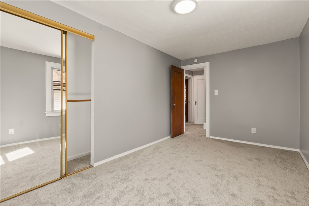 67 Harwick Road Irondequoit, NY 14609 - Photo 20 of 33 Bedroom #2 featuring brand new carpet & vinyl windows