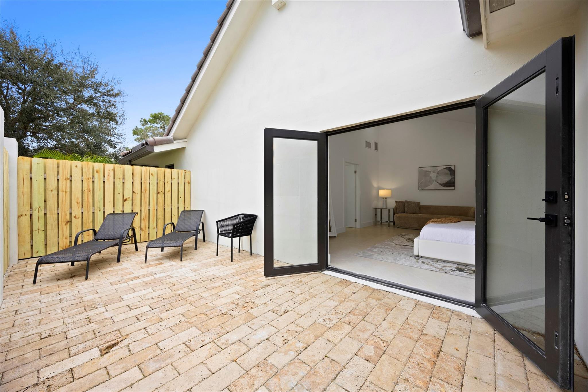 7571 Estrella Circle Boca Raton, FL 33433 - Photo 37 of 79 a bedroom with a bed and a chair