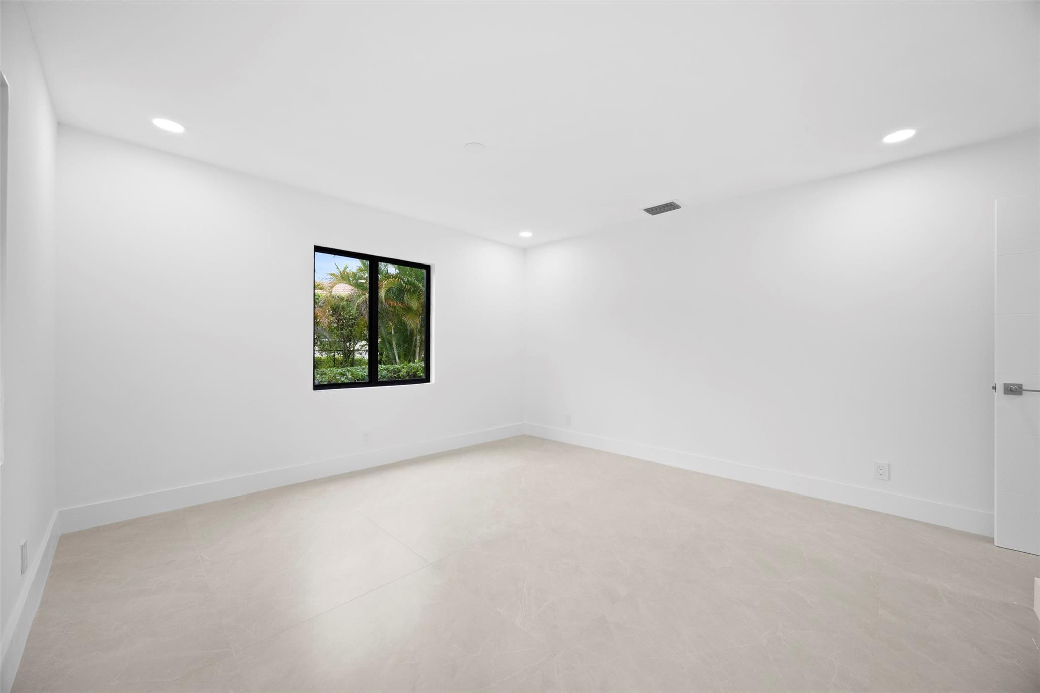 7571 Estrella Circle Boca Raton, FL 33433 - Photo 50 of 79 an empty room with windows