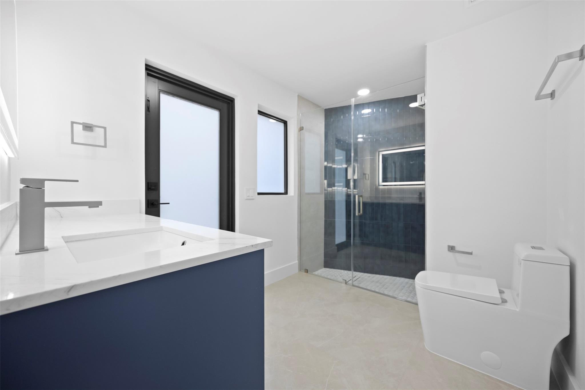 7571 Estrella Circle Boca Raton, FL 33433 - Photo 54 of 79 a spacious bathroom with a bathtub sink and mirror