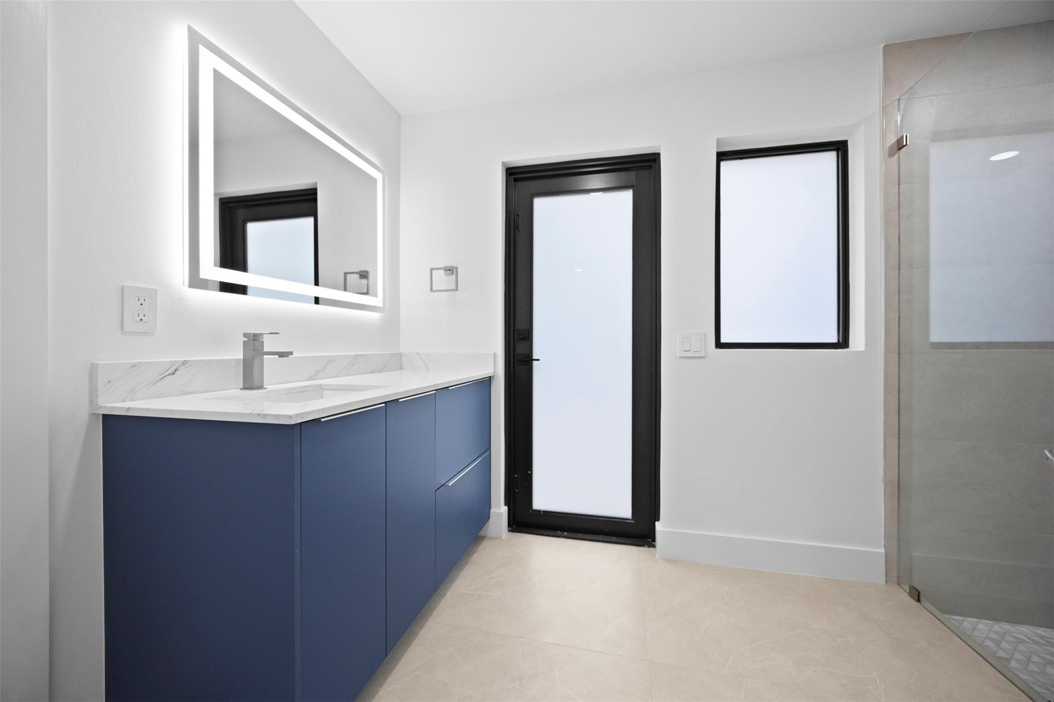 7571 Estrella Circle Boca Raton, FL 33433 - Photo 55 of 79 a bathroom with a sink and a mirror