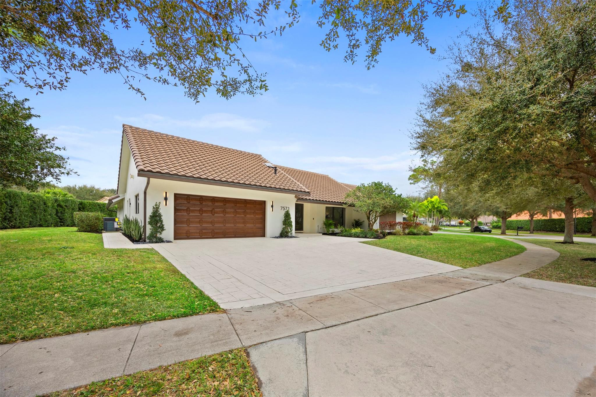 7571 Estrella Circle Boca Raton, FL 33433 - Photo 67 of 79 a front view of a house with yard and green space