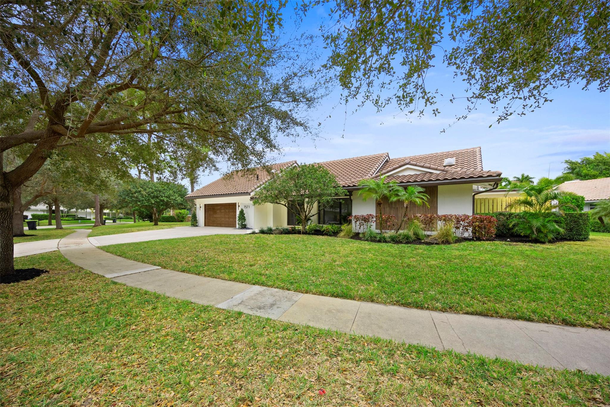 7571 Estrella Circle Boca Raton, FL 33433 - Photo 69 of 79 a front view of house with yard and green space