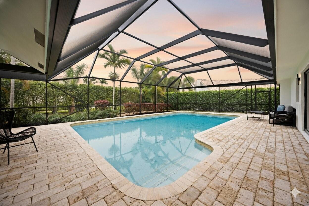 7571 Estrella Circle Boca Raton, FL 33433 - Photo 7 of 79 a view of a swimming pool with a porch