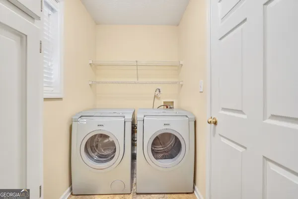 a utility room with dryer and washer