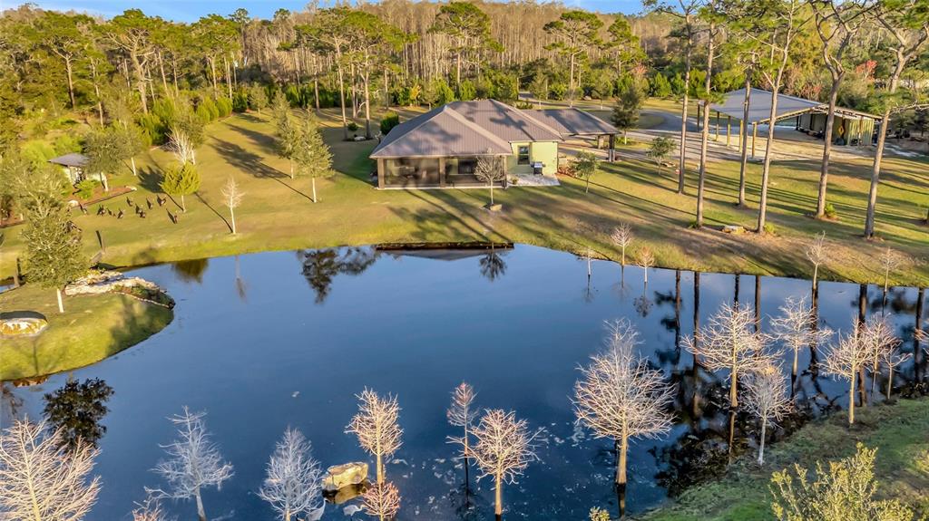7330 Crabgrass Road St. Cloud, FL 34773 - Photo 45 of 60 a view of a house with a swimming pool