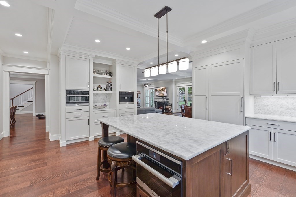 39 Hutter Ridge Road Needham, MA 02492 - Photo 5 of 42 a kitchen with a table and chairs in it