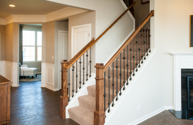 284 Monument Road Elgin, IL 60124 - Photo 8 of 13 a view of staircase with lots of frames on wall and a large window