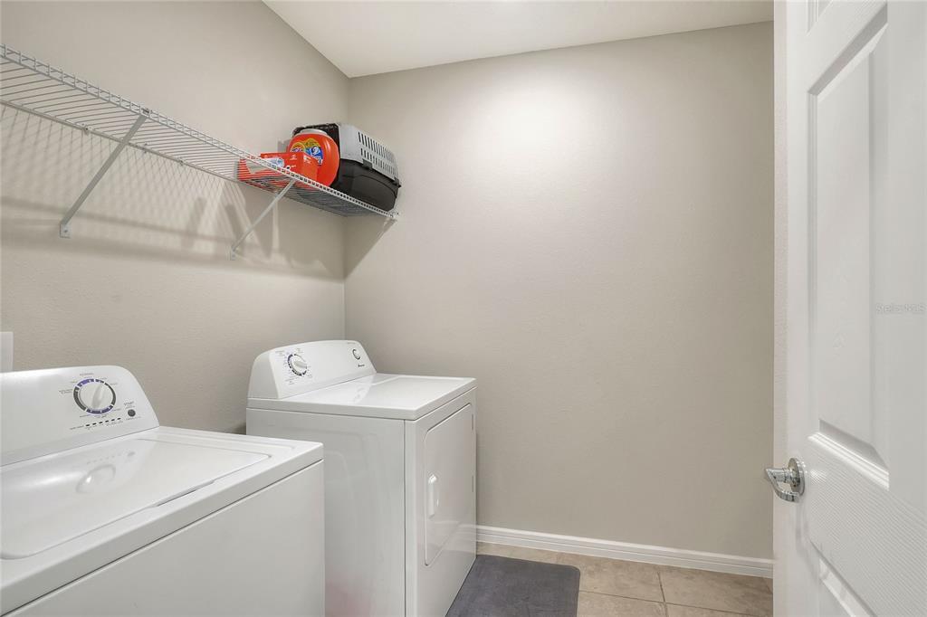 1623 Aspen Avenue Davenport, FL 33837 - Photo 12 of 43 a utility room with dryer and washer