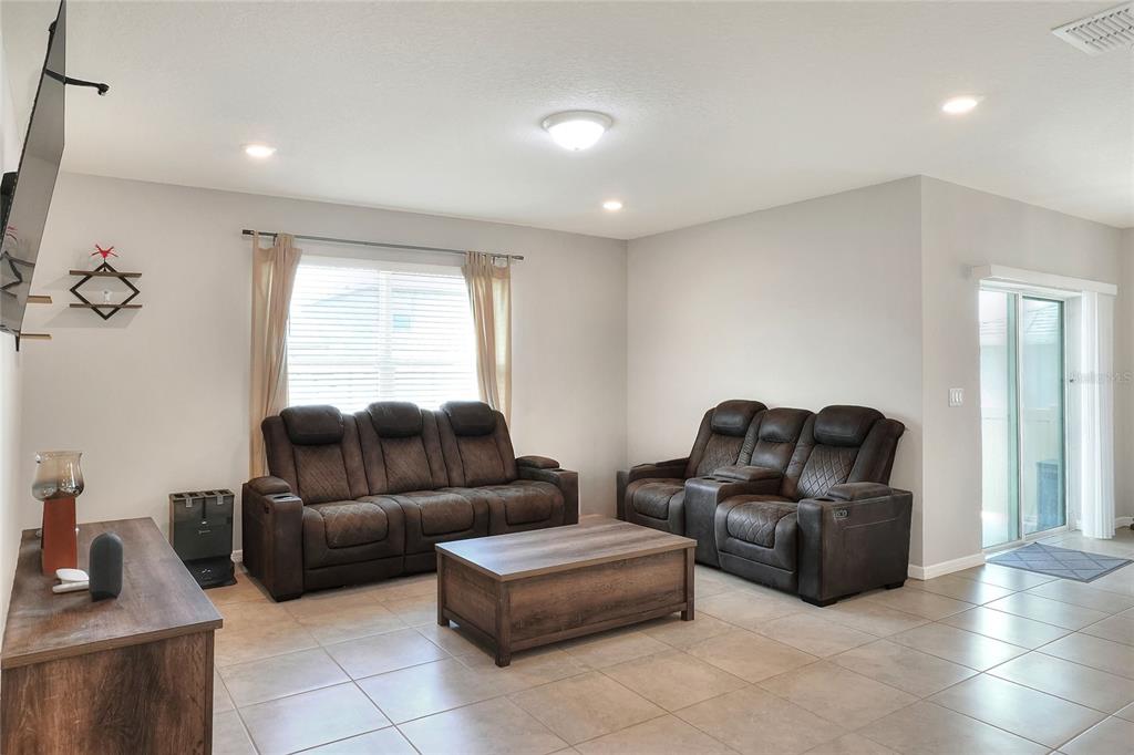 1623 Aspen Avenue Davenport, FL 33837 - Photo 13 of 43 a living room with furniture and a window