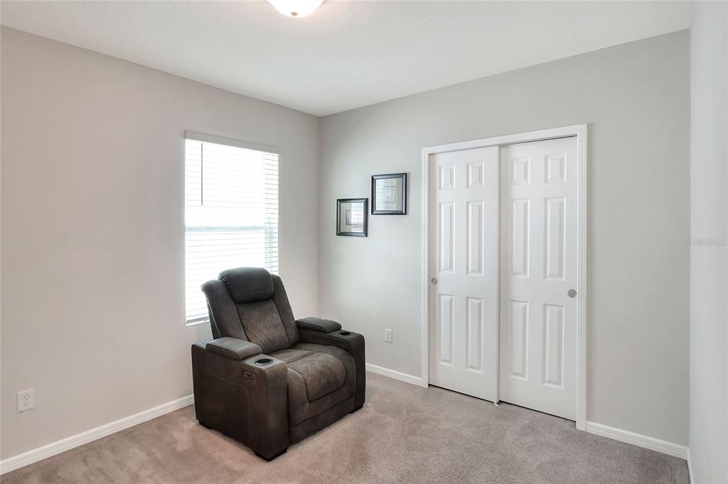 1623 Aspen Avenue Davenport, FL 33837 - Photo 16 of 43 a living room with furniture and a window