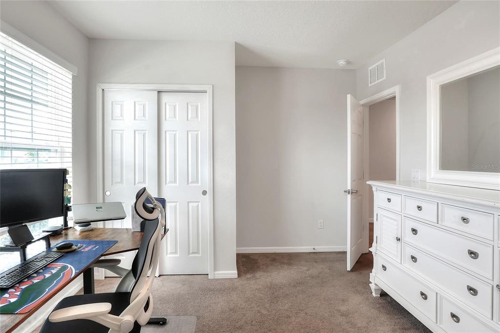 1623 Aspen Avenue Davenport, FL 33837 - Photo 17 of 43 a view of a workspace with furniture and a window