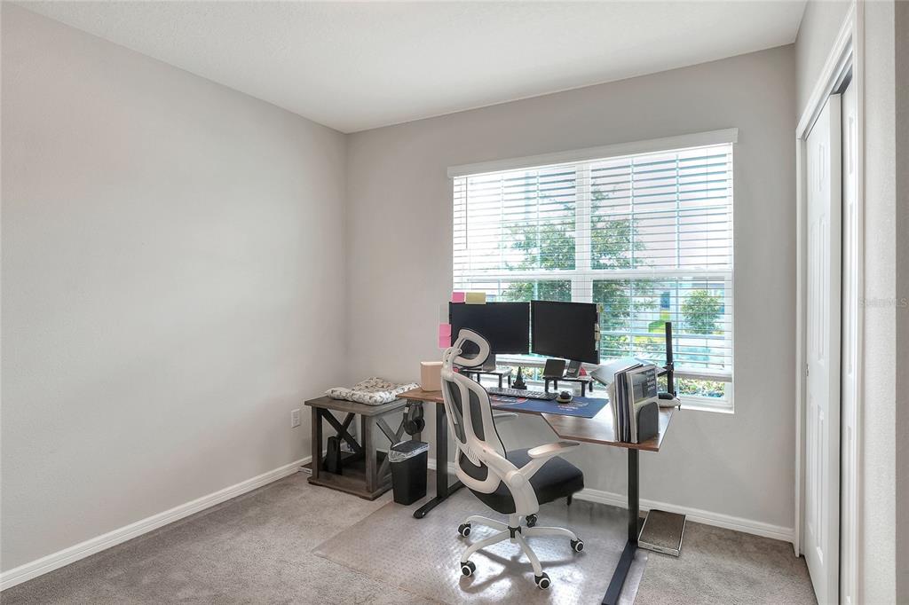 1623 Aspen Avenue Davenport, FL 33837 - Photo 18 of 43 a view of a workspace with furniture and a window