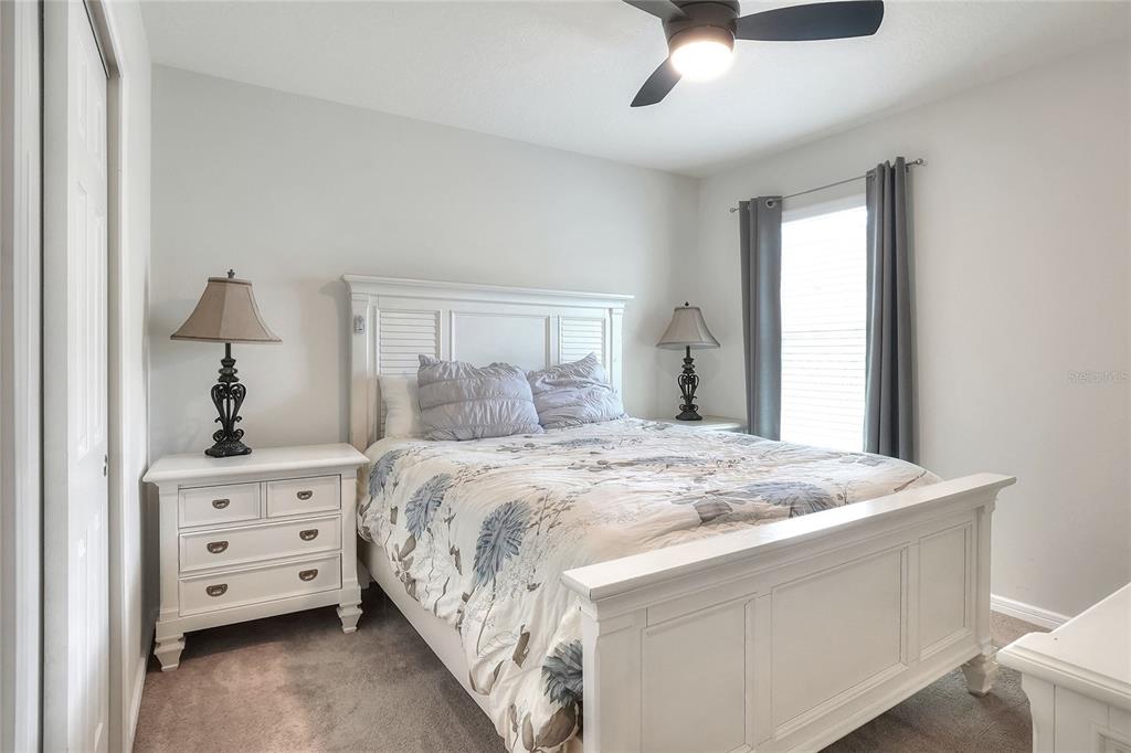 1623 Aspen Avenue Davenport, FL 33837 - Photo 25 of 43 a bedroom with a bed and a window