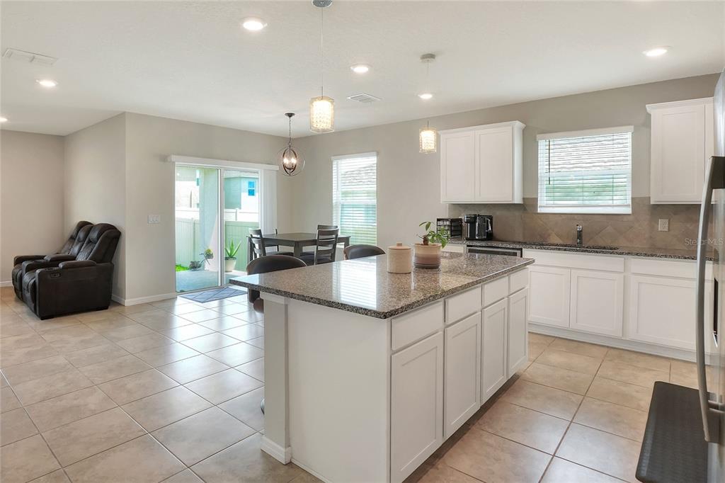 1623 Aspen Avenue Davenport, FL 33837 - Photo 4 of 43 a kitchen with a sink and cabinets