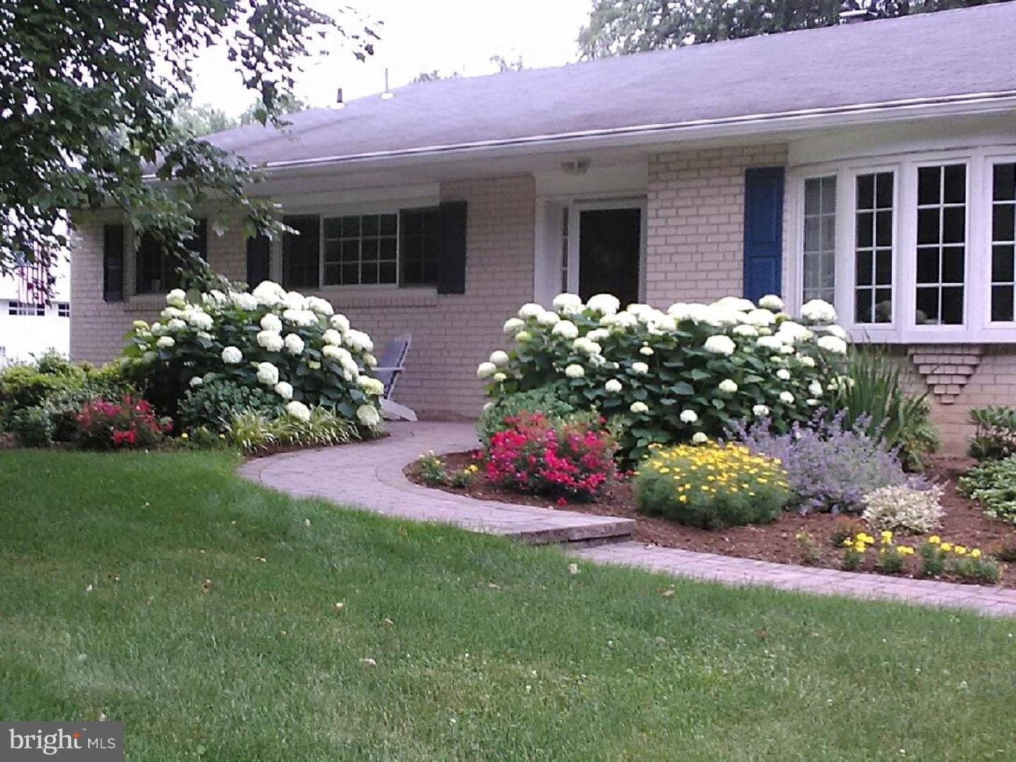 275 Old State Road Berwyn, PA 19312 - Photo 2 of 21 a front view of a house with a yard