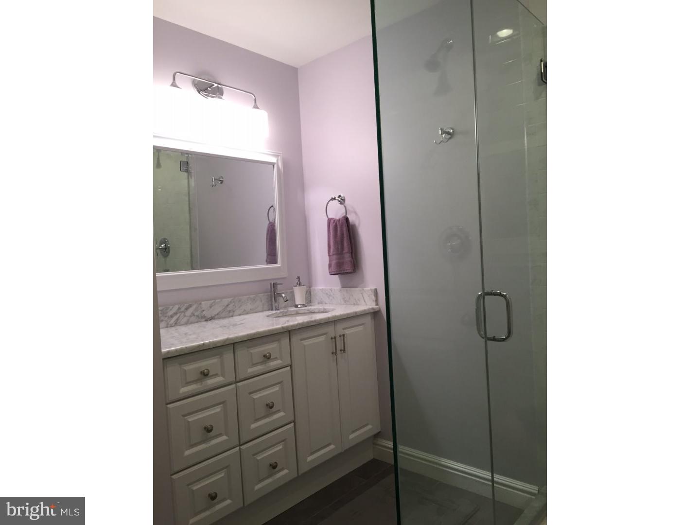 275 Old State Road Berwyn, PA 19312 - Photo 11 of 21 a bathroom with a granite countertop sink a mirror and a vanity