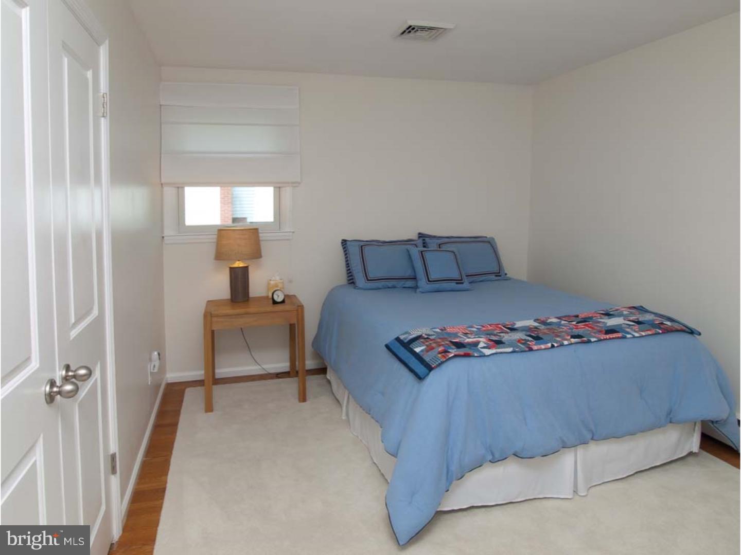 275 Old State Road Berwyn, PA 19312 - Photo 15 of 21 a bedroom with a bed and a lamp