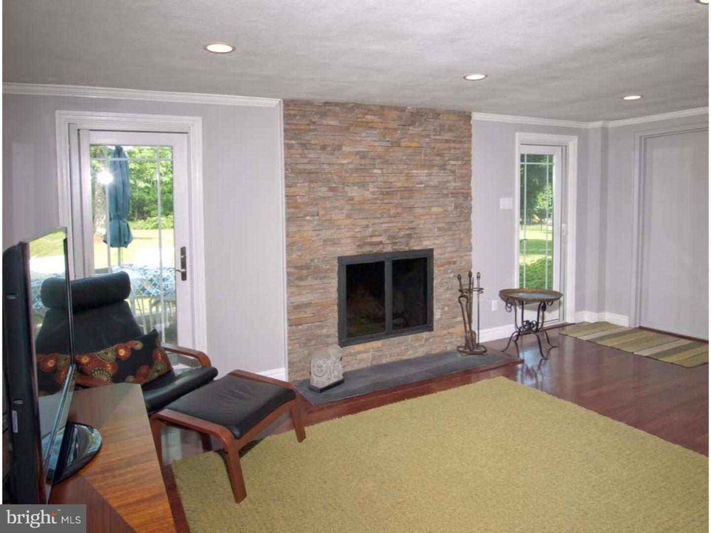 275 Old State Road Berwyn, PA 19312 - Photo 16 of 21 a living room with furniture and a fireplace