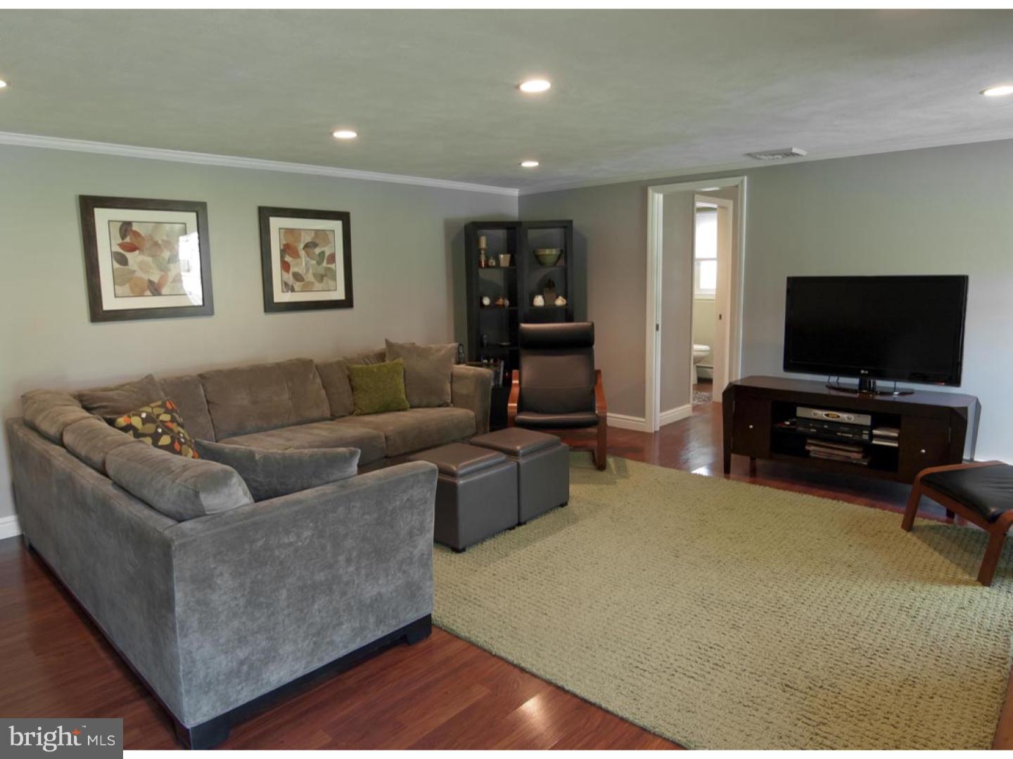 275 Old State Road Berwyn, PA 19312 - Photo 17 of 21 a living room with furniture and a flat screen tv