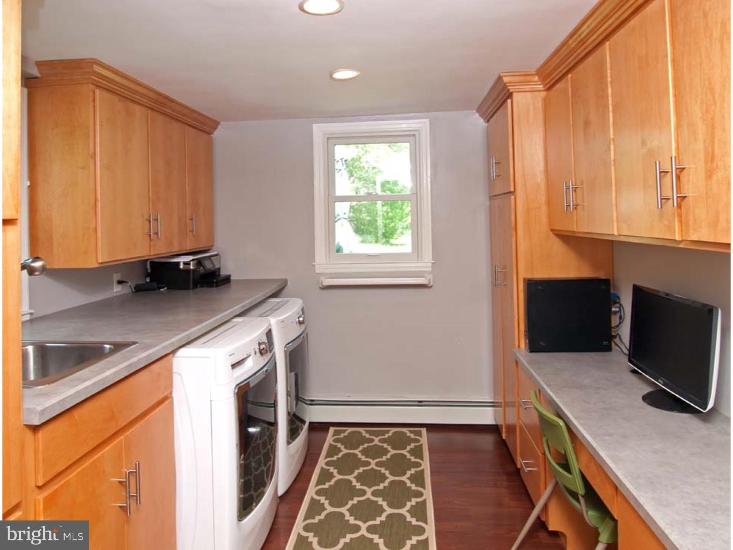 275 Old State Road Berwyn, PA 19312 - Photo 18 of 21 a kitchen with granite countertop a sink and a stove top oven