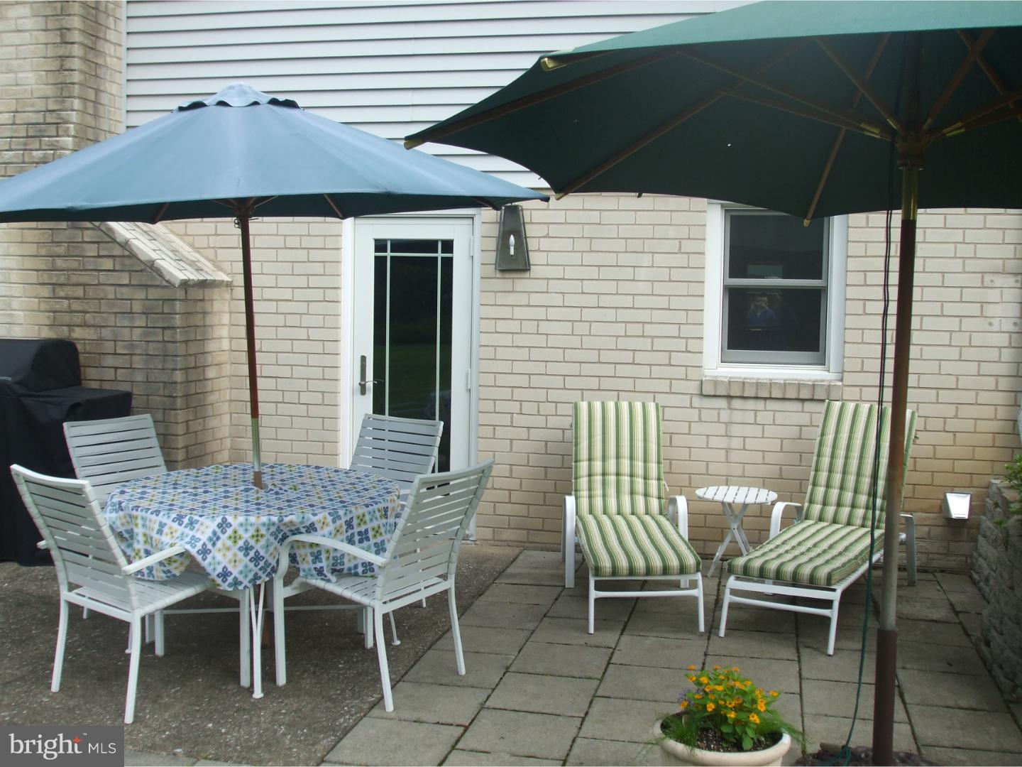 275 Old State Road Berwyn, PA 19312 - Photo 20 of 21 a patio with table and chairs