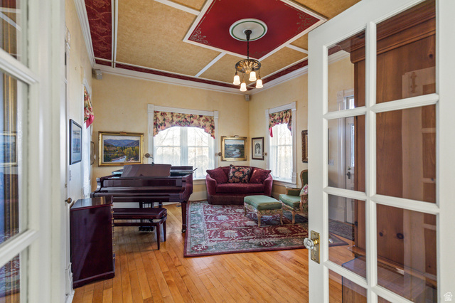 390 North 100 West Monroe, UT 84754 - Photo 105 of 167 Living area with wood-type flooring, a chandelier, and french doors