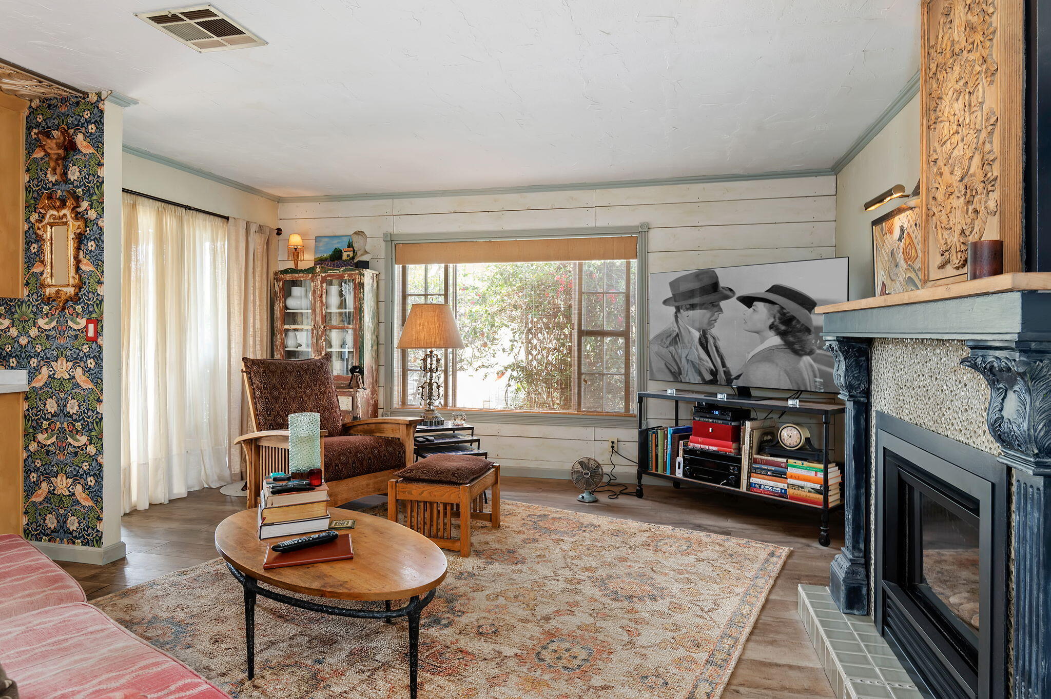340 Old Mill Road, Unit 26 Santa Barbara, CA 93110 - Photo 12 of 31 a living room with furniture a flat screen tv and a fireplace