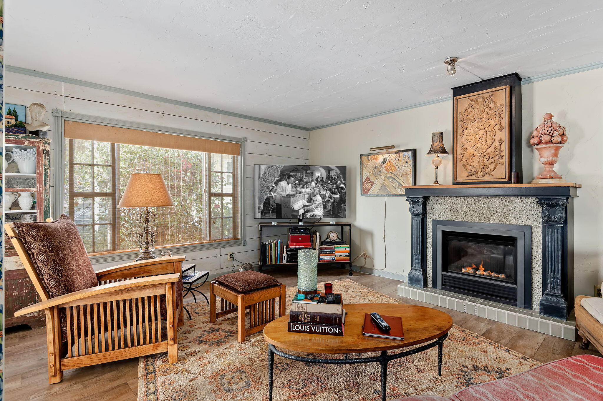 340 Old Mill Road, Unit 26 Santa Barbara, CA 93110 - Photo 13 of 31 a living room with furniture a fireplace and a large window