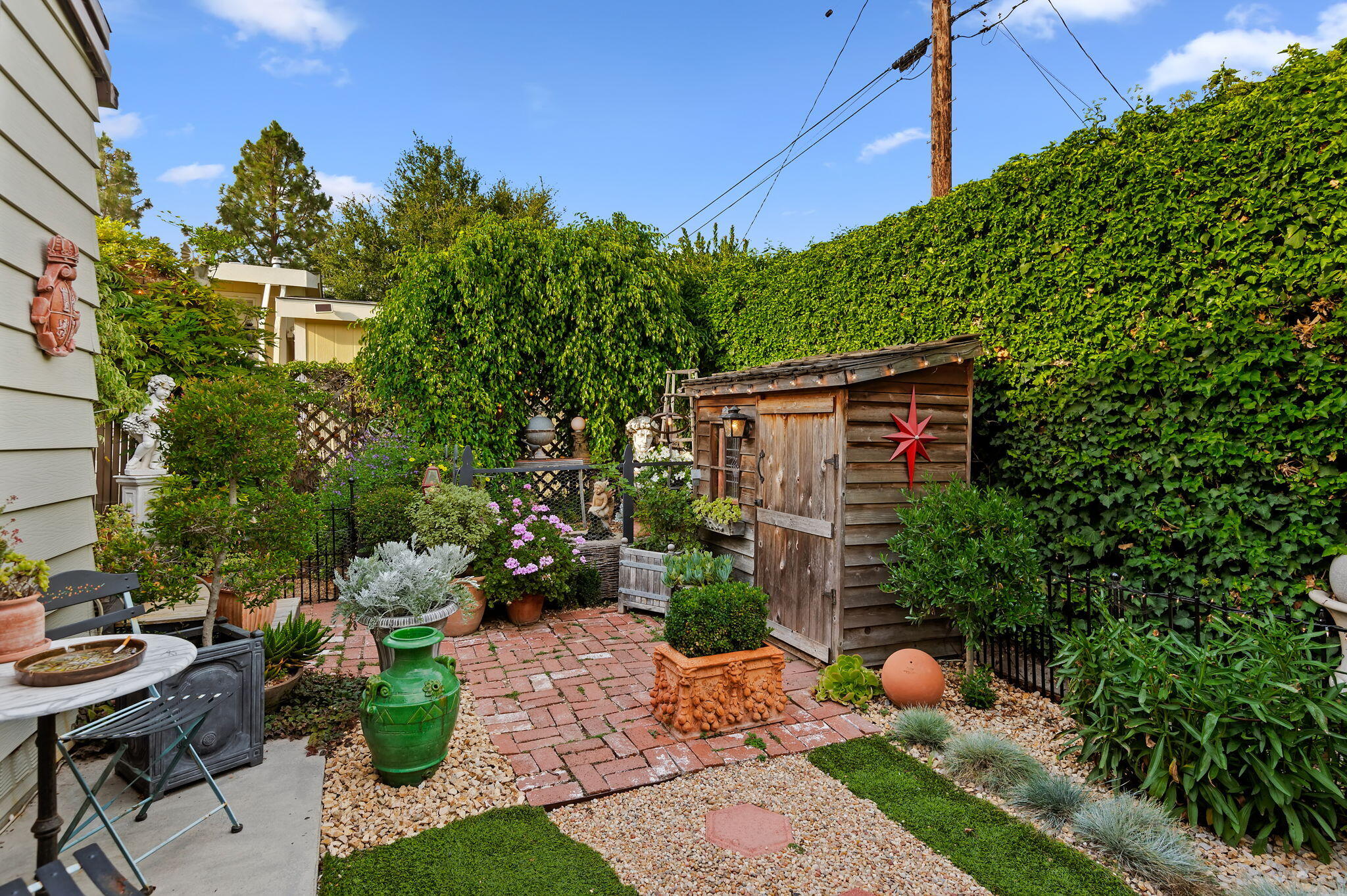 340 Old Mill Road, Unit 26 Santa Barbara, CA 93110 - Photo 24 of 31 a view of a chairs and table in backyard