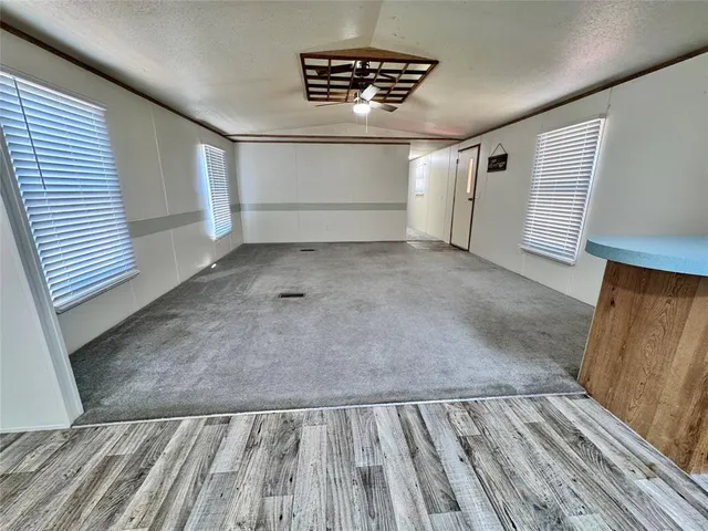a view of wooden floor in an empty room