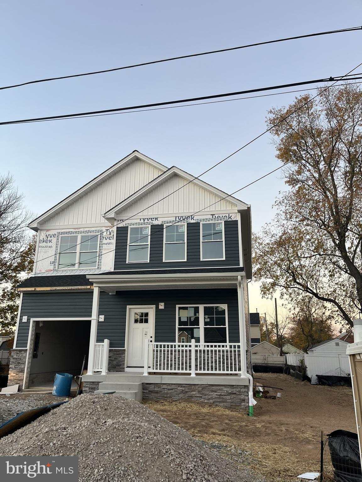 8478 Garden Road Pasadena, MD 21122 - Photo 14 of 14 a front view of a house with a yard