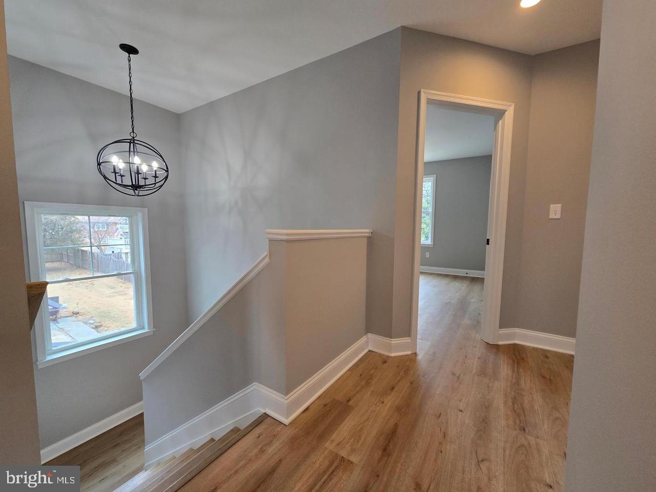 8478 Garden Road Pasadena, MD 21122 - Photo 7 of 14 a view of empty room with wooden floor