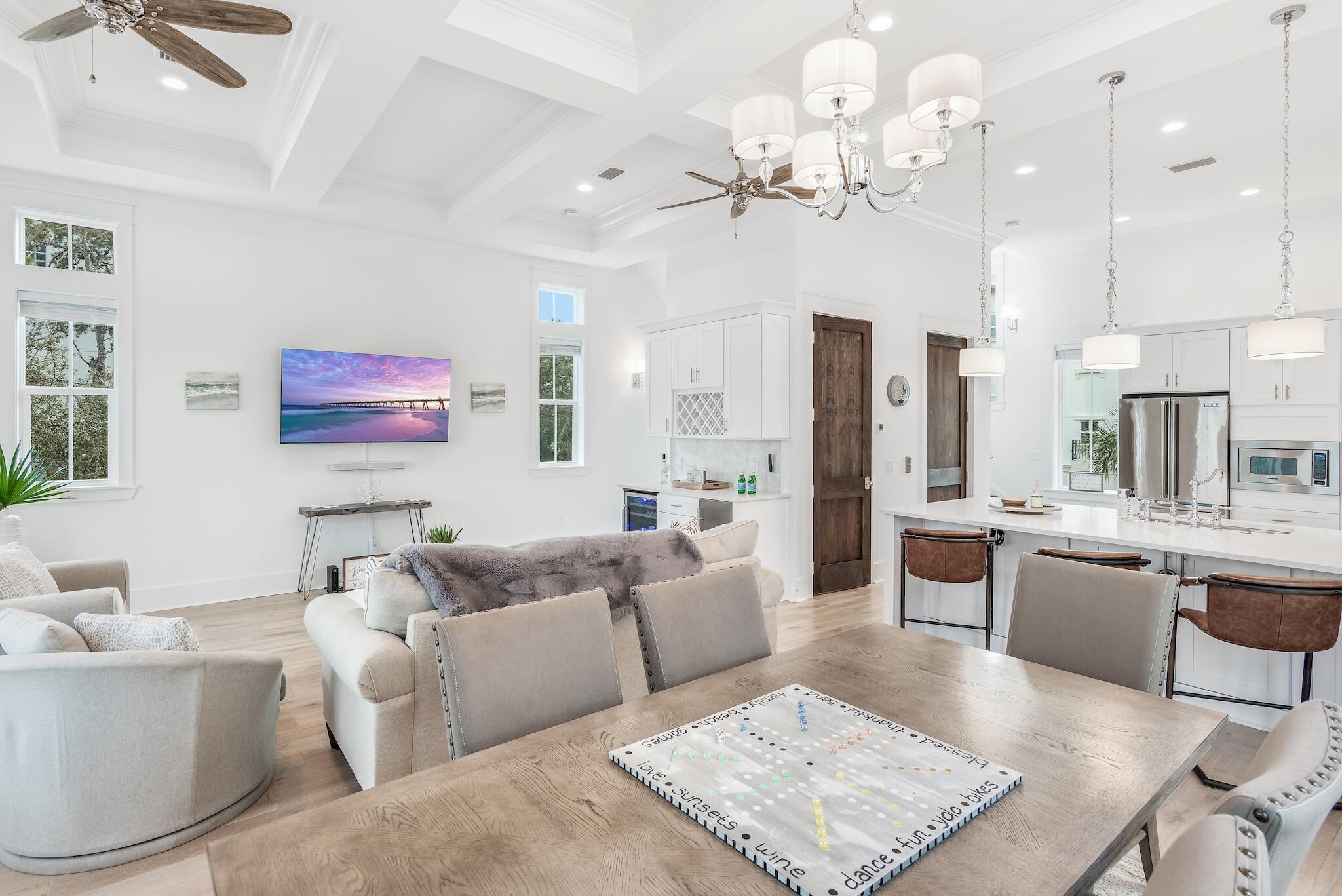 81 Palmeira Way Santa Rosa Beach, FL 32459 - Photo 24 of 74 a living room with furniture a chandelier and a fireplace