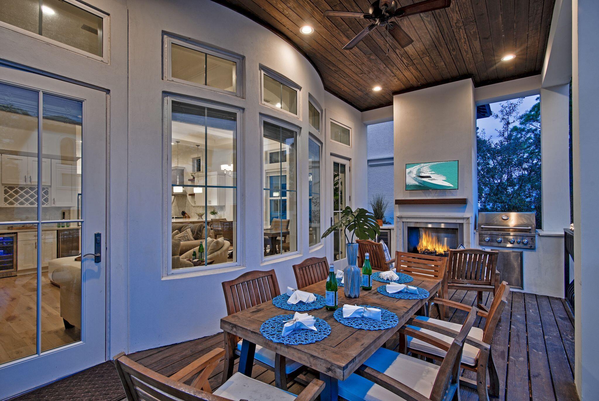 81 Palmeira Way Santa Rosa Beach, FL 32459 - Photo 25 of 74 a view of a dining room with furniture a chandelier and wooden floor