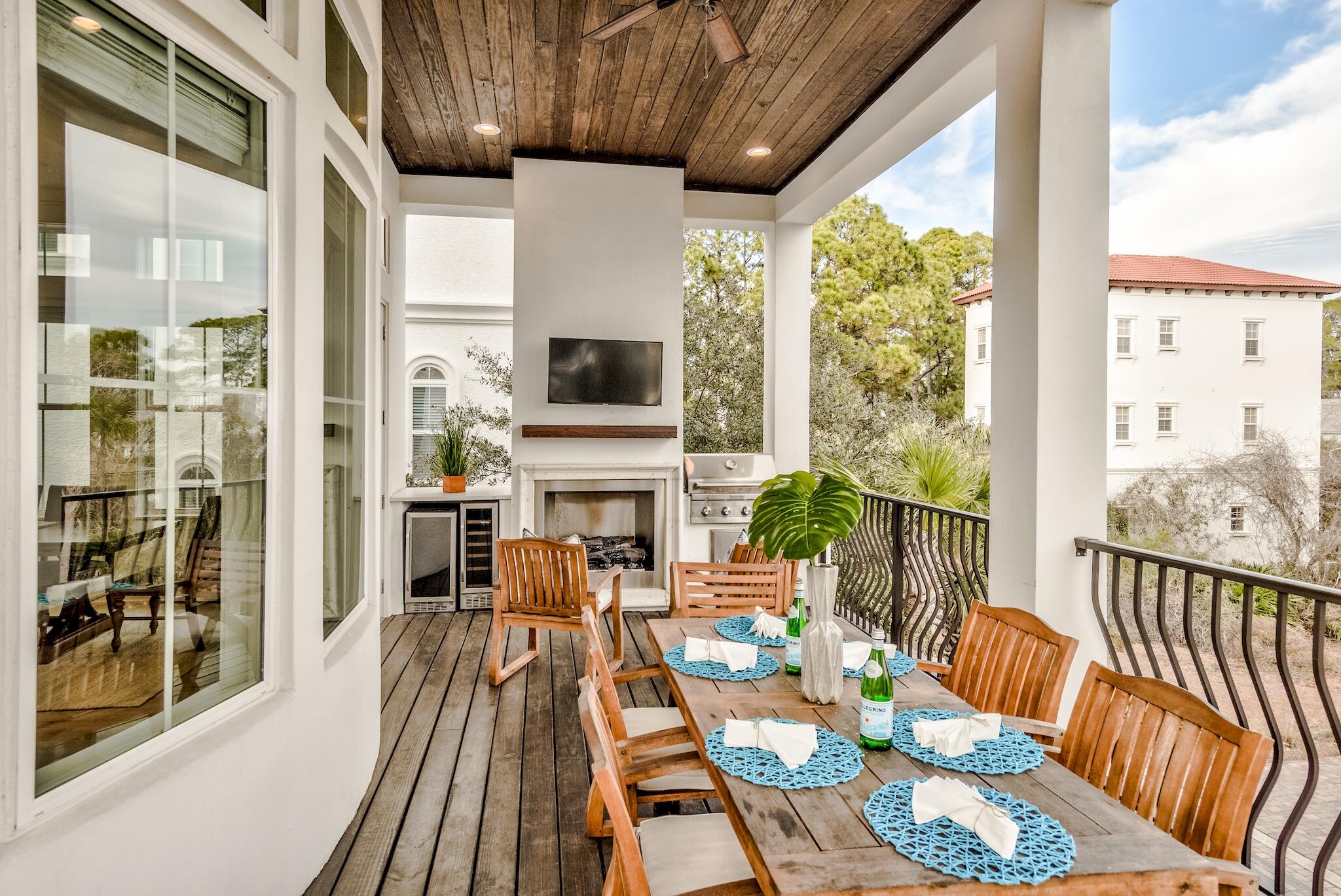 81 Palmeira Way Santa Rosa Beach, FL 32459 - Photo 27 of 74 a living room with furniture fireplace and a large window
