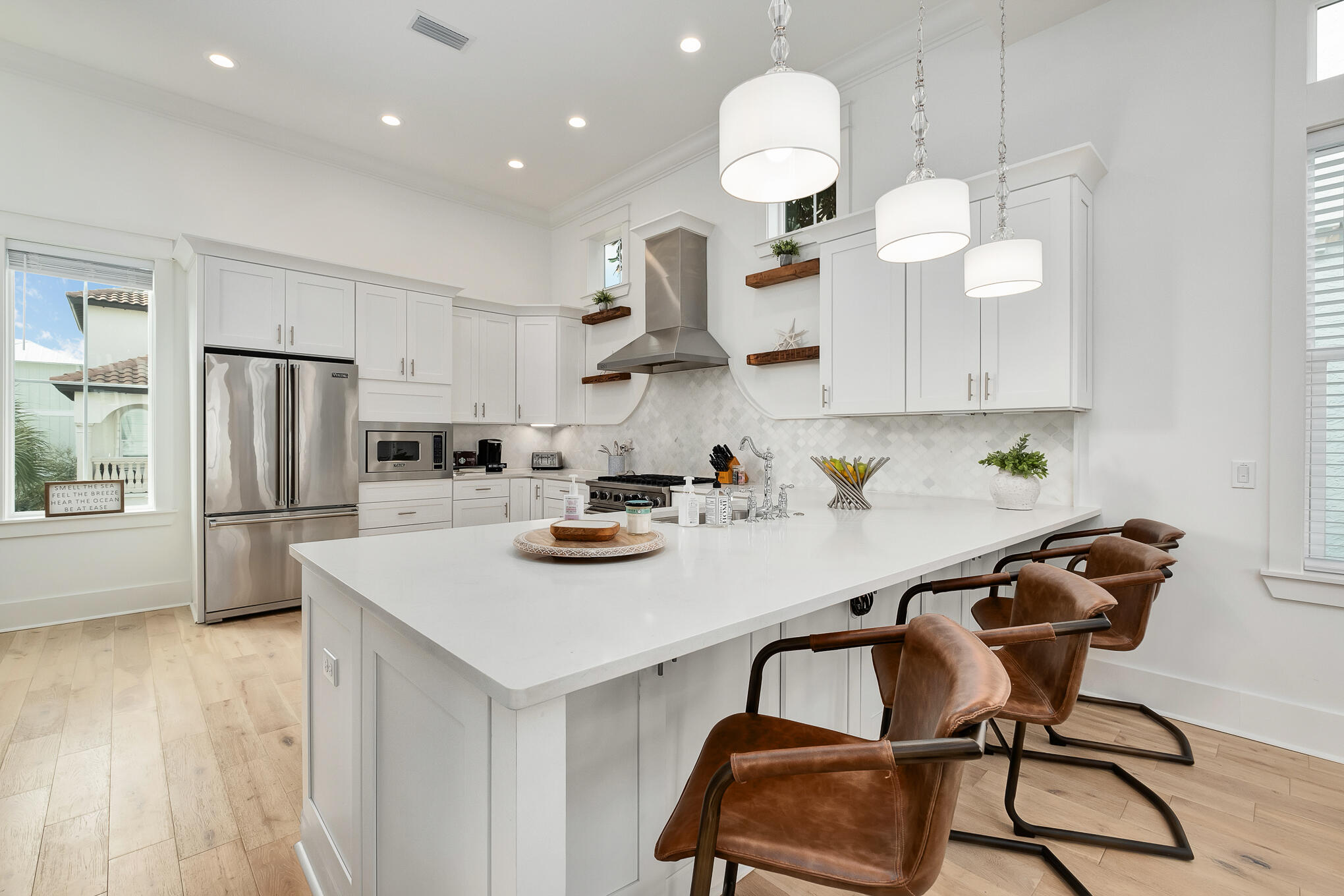 81 Palmeira Way Santa Rosa Beach, FL 32459 - Photo 31 of 74 a kitchen with a table chairs stove and microwave