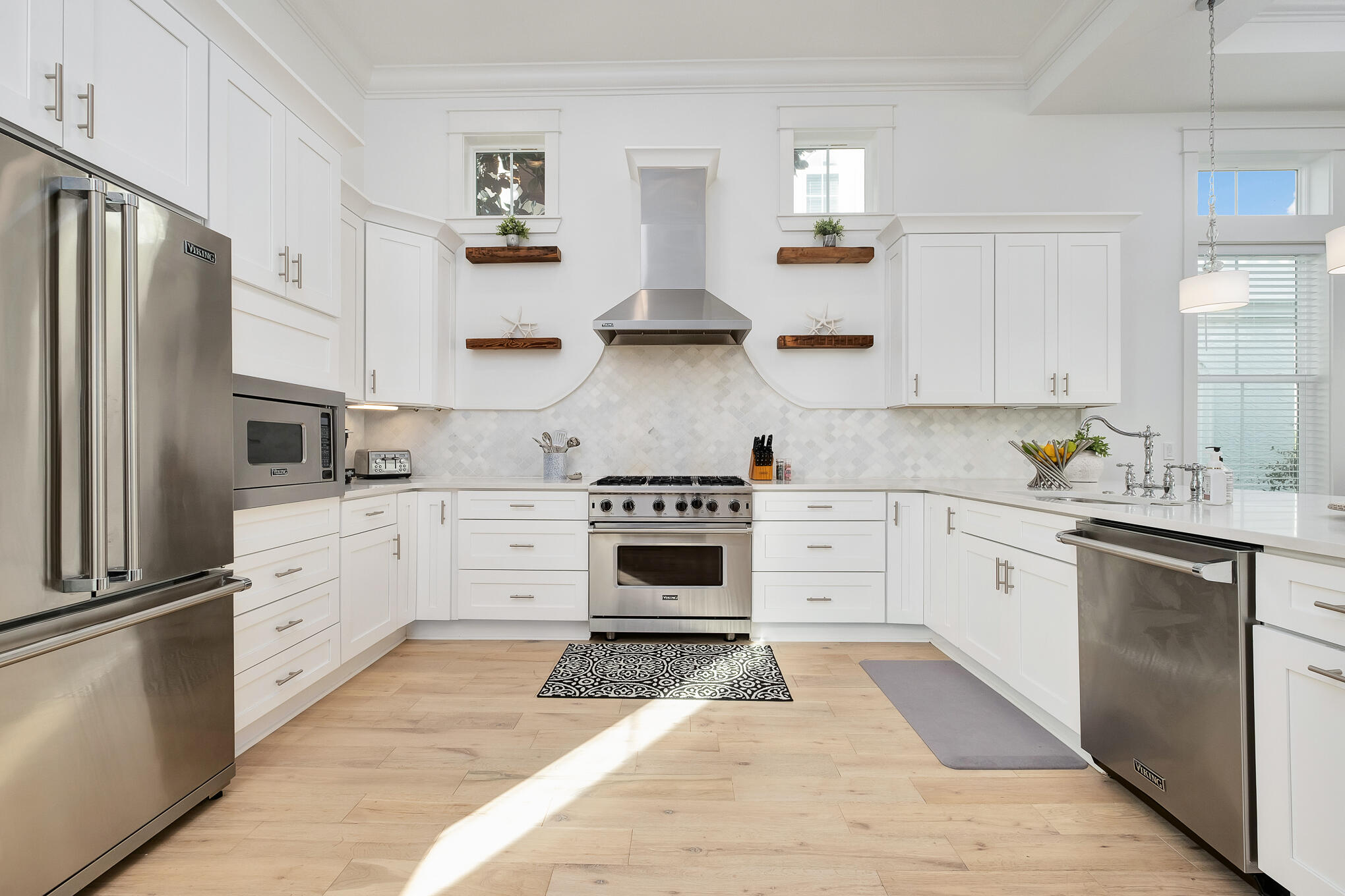 81 Palmeira Way Santa Rosa Beach, FL 32459 - Photo 32 of 74 a kitchen with cabinets stainless steel appliances and a window