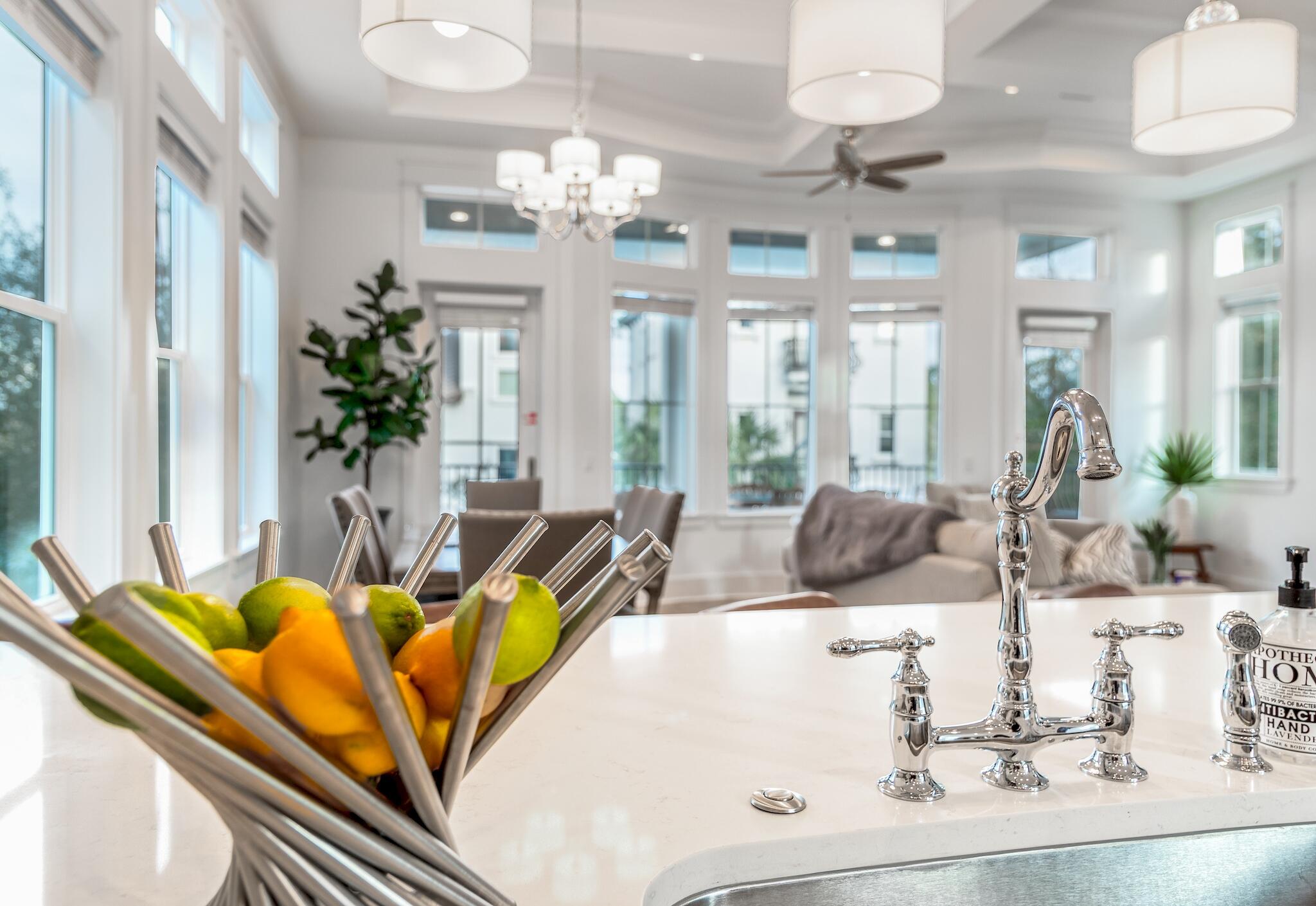 81 Palmeira Way Santa Rosa Beach, FL 32459 - Photo 35 of 74 a view of a dining room with furniture a chandelier and large windows
