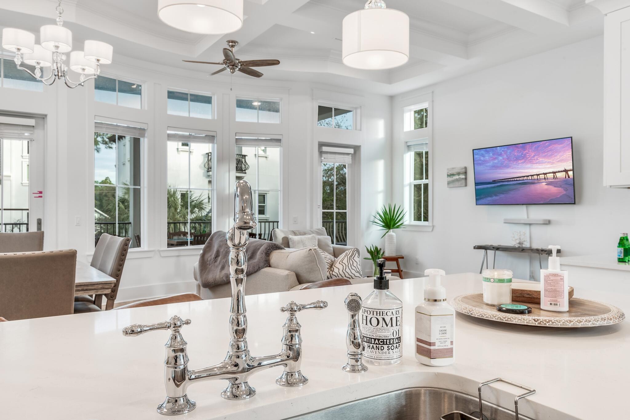 81 Palmeira Way Santa Rosa Beach, FL 32459 - Photo 36 of 74 a living room with furniture chandelier and a large window
