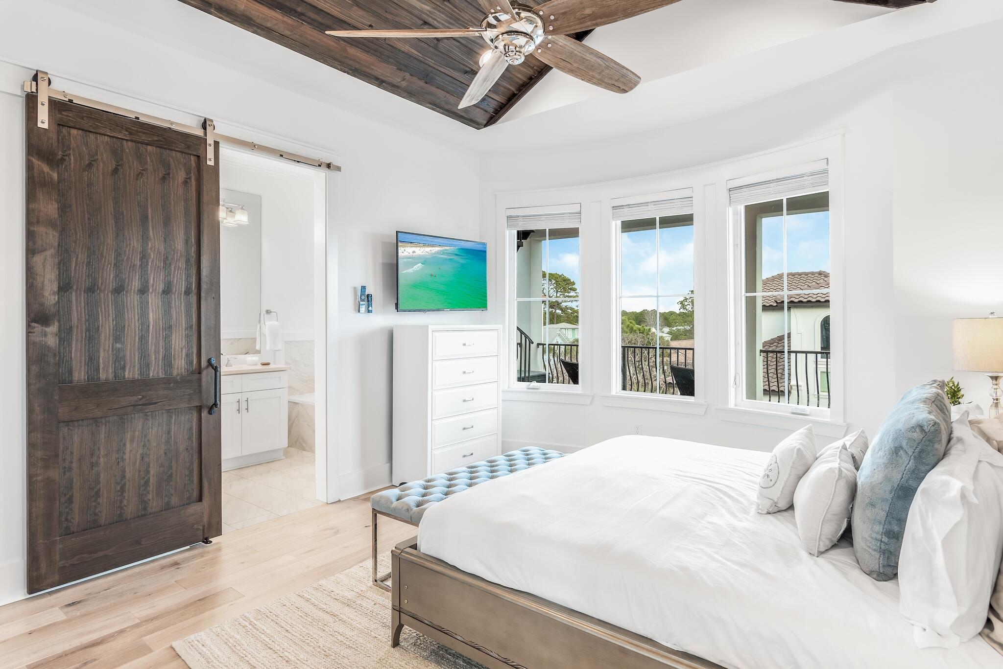 81 Palmeira Way Santa Rosa Beach, FL 32459 - Photo 39 of 74 a bedroom with a bed and a large window